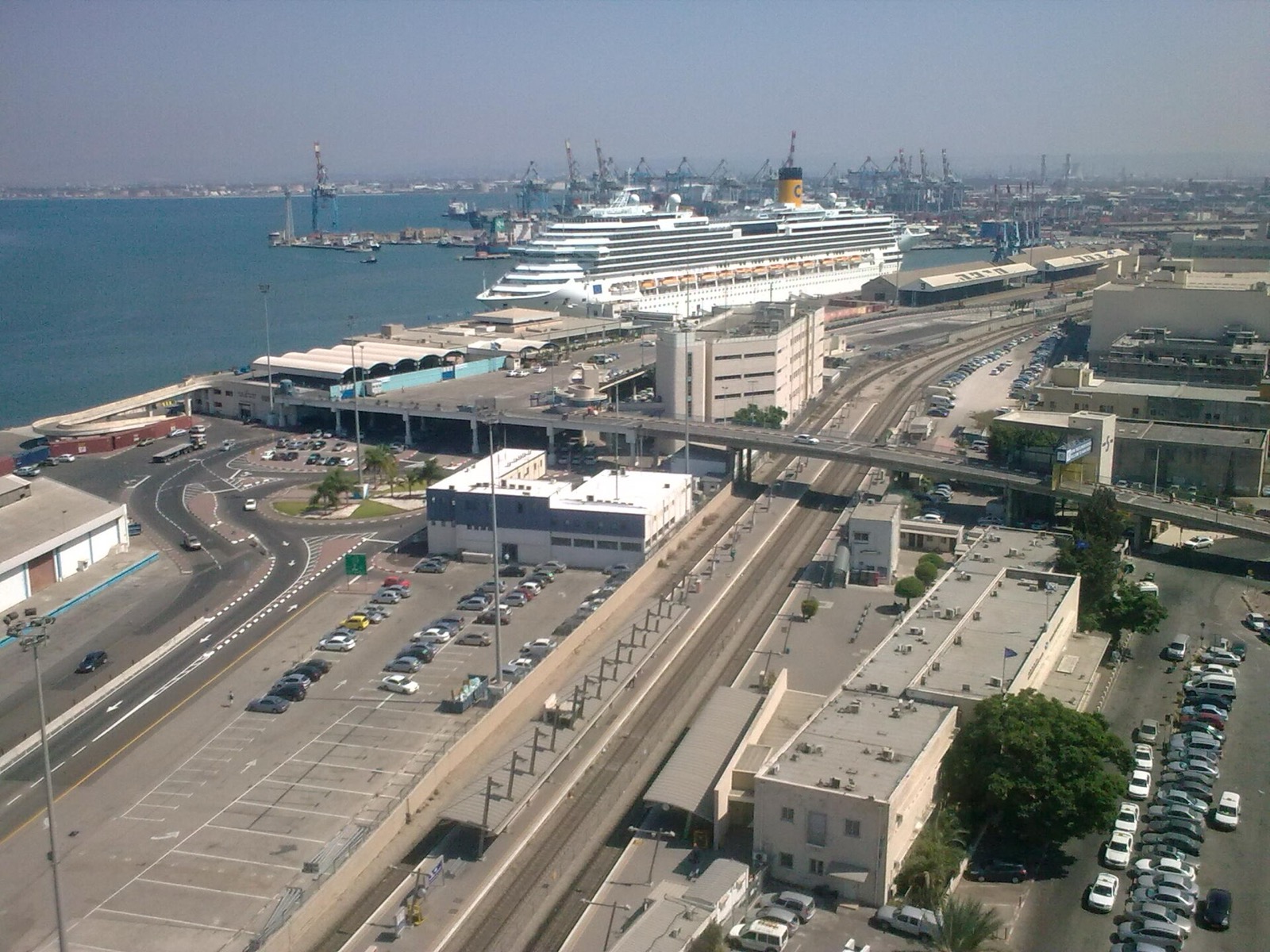 Mediterranean cruise port with ships and coastal city views