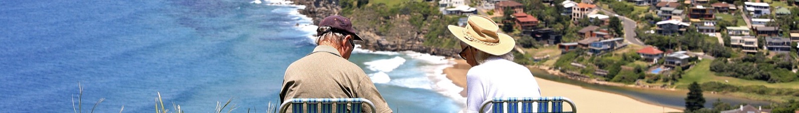 Retired travelers enjoying a scenic overlook picnic